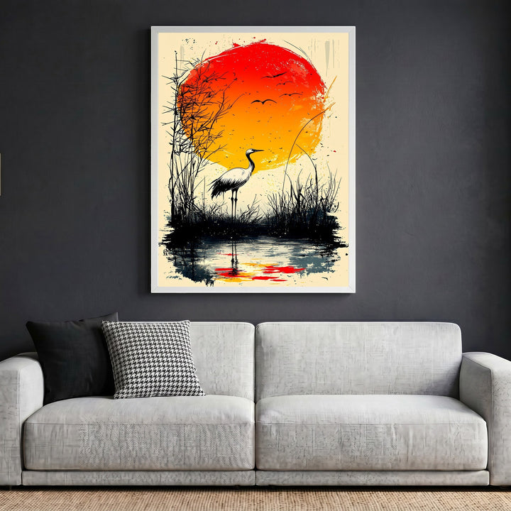 Wadi Home Japanese inspired crane wall art print featuring a red sun and marsh landscape above a modern grey sofa.