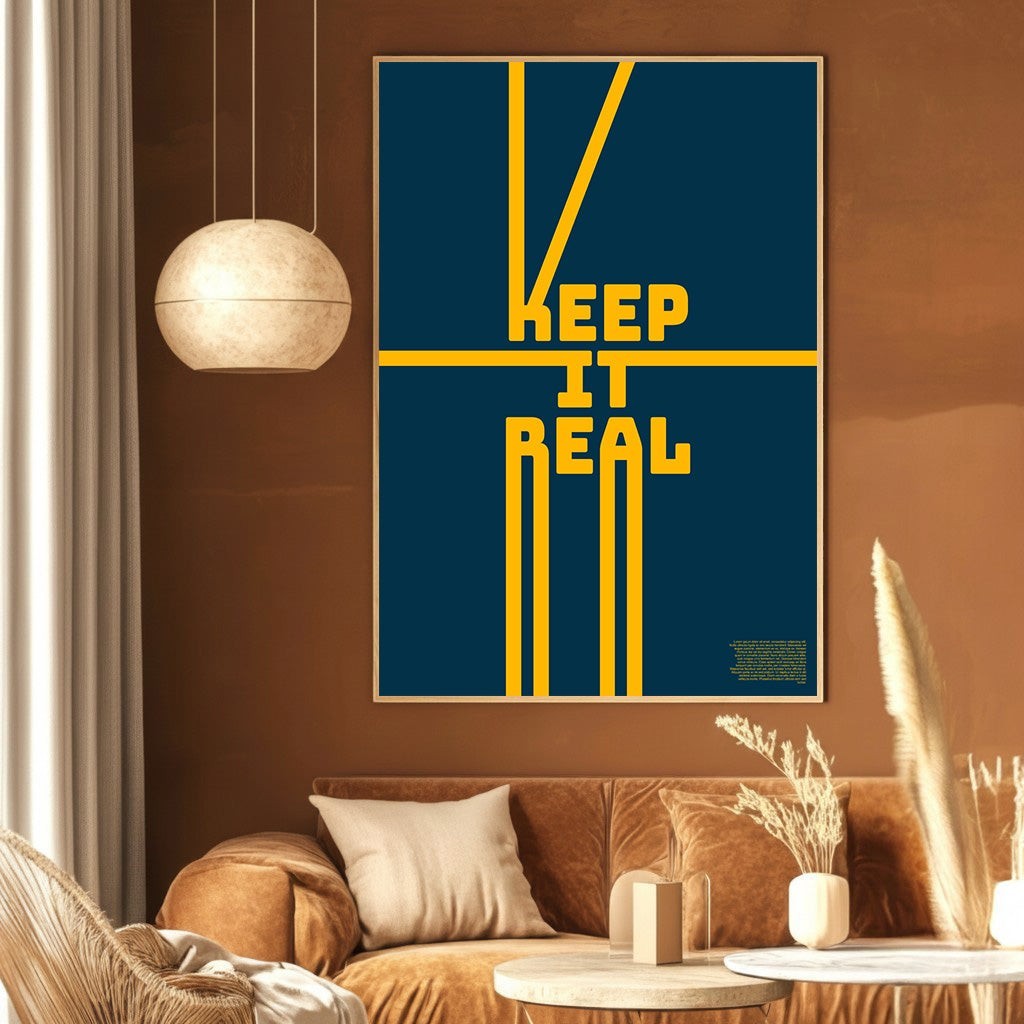 Wadi Home Keep It Real typography poster with yellow text on a navy blue background in a modern living room.