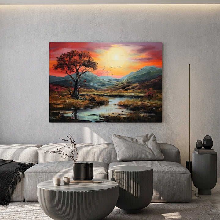 Wadi Home landscape oil painting featuring a sunset over a valley with vibrant orange and crimson tones on a living room wall.