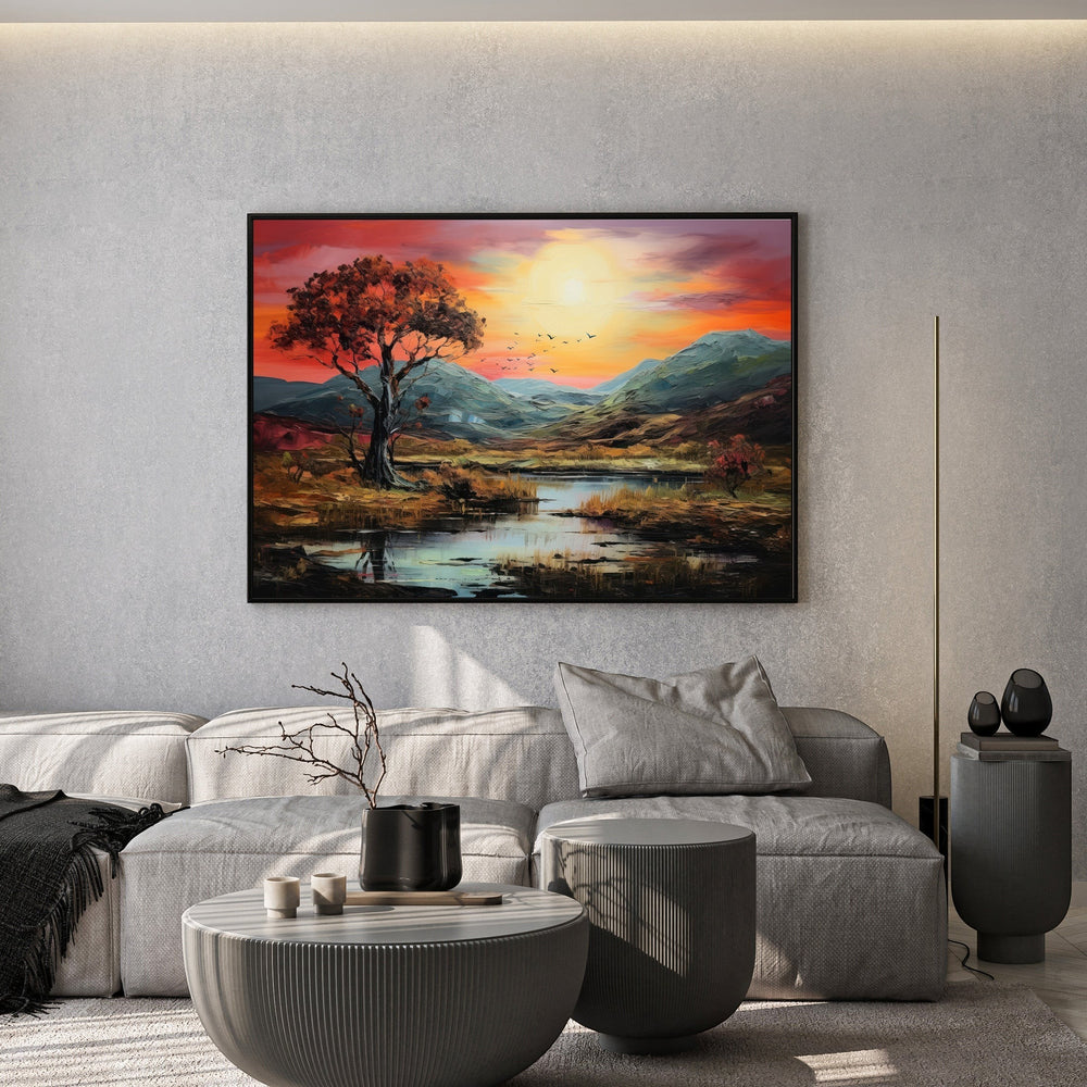 Wadi Home landscape oil painting featuring a vibrant sunset over a valley, displayed above a modern grey sofa.