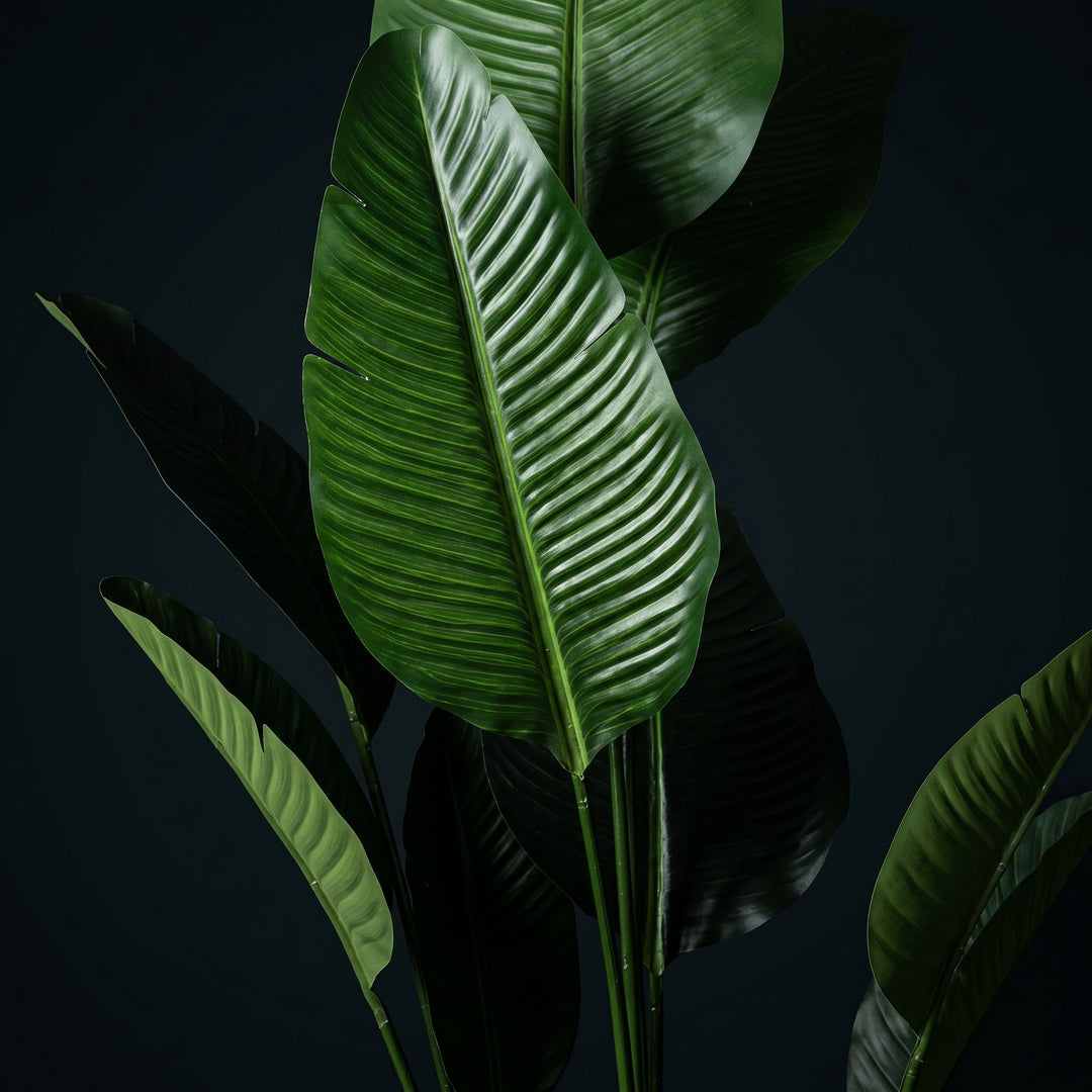 Wadi Home Large Bird of Paradise artificial plant with lush green leaves and intricate veining. Realistic tropical decor.