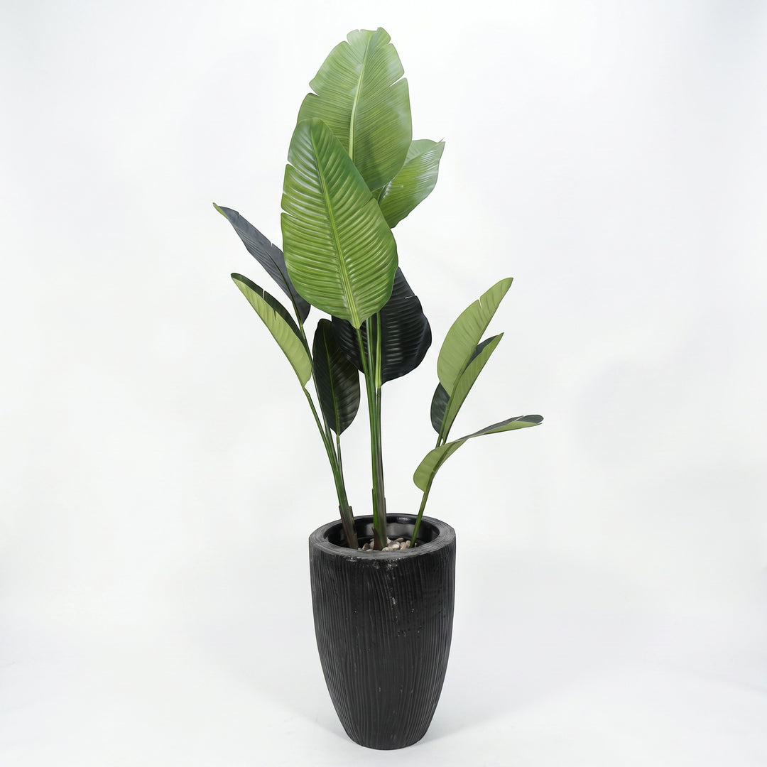Wadi Home Large Bird of Paradise artificial plant with lush green leaves in a textured black pot.