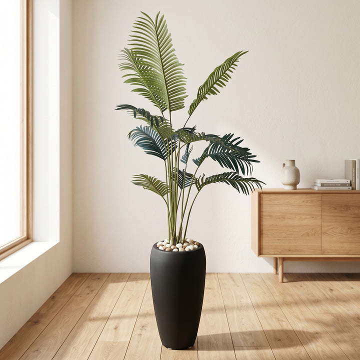 Wadi Home Large Faux Areca Palm Plant in tall black planter with river stones. Lush green fronds.