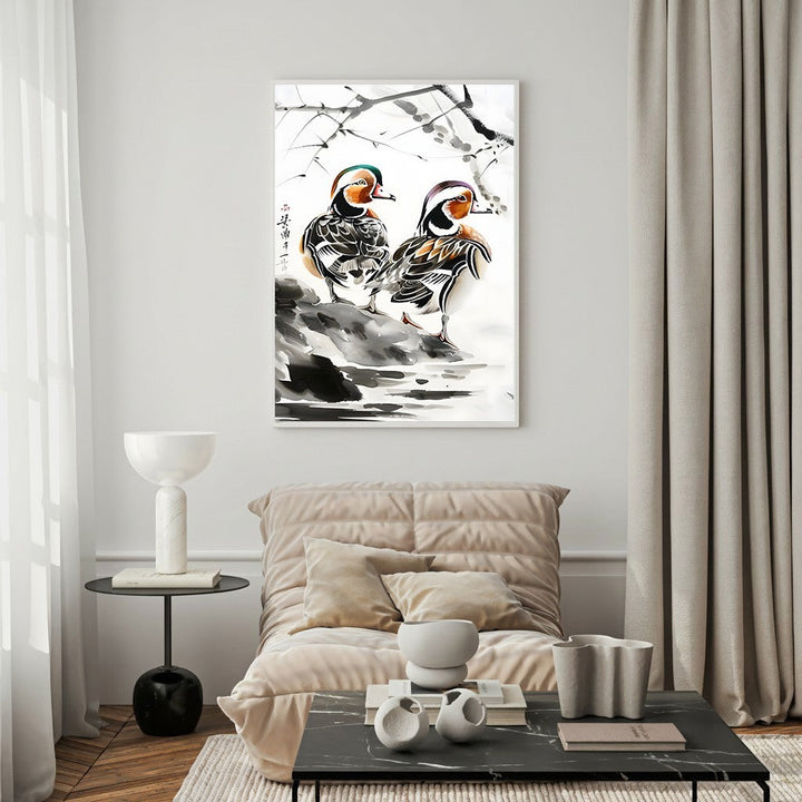 Wadi Home watercolor painting of two vibrant mandarin ducks on a rocky shore with subtle ink brushstrokes and blossoming branches.