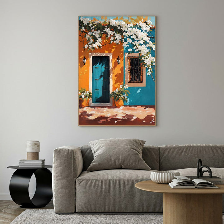 Wadi Home Mediterranean painting: teal door, orange & blue facade, white flowers, wrought iron window, potted plants.
