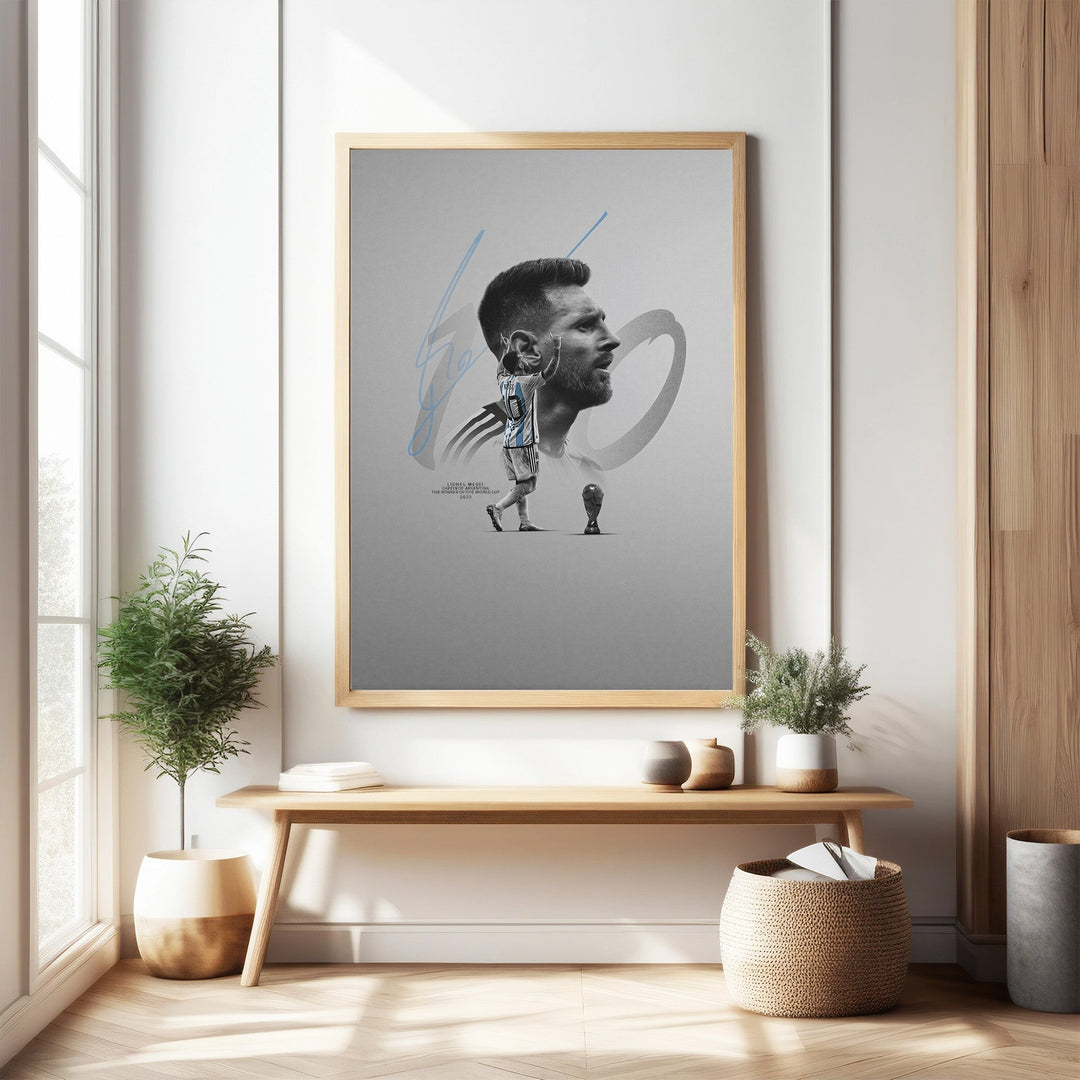 Wadi Home framed wall art featuring a minimalist portrait of soccer legend Lionel Messi in his Argentina jersey, with his signature and a trophy graphic.
