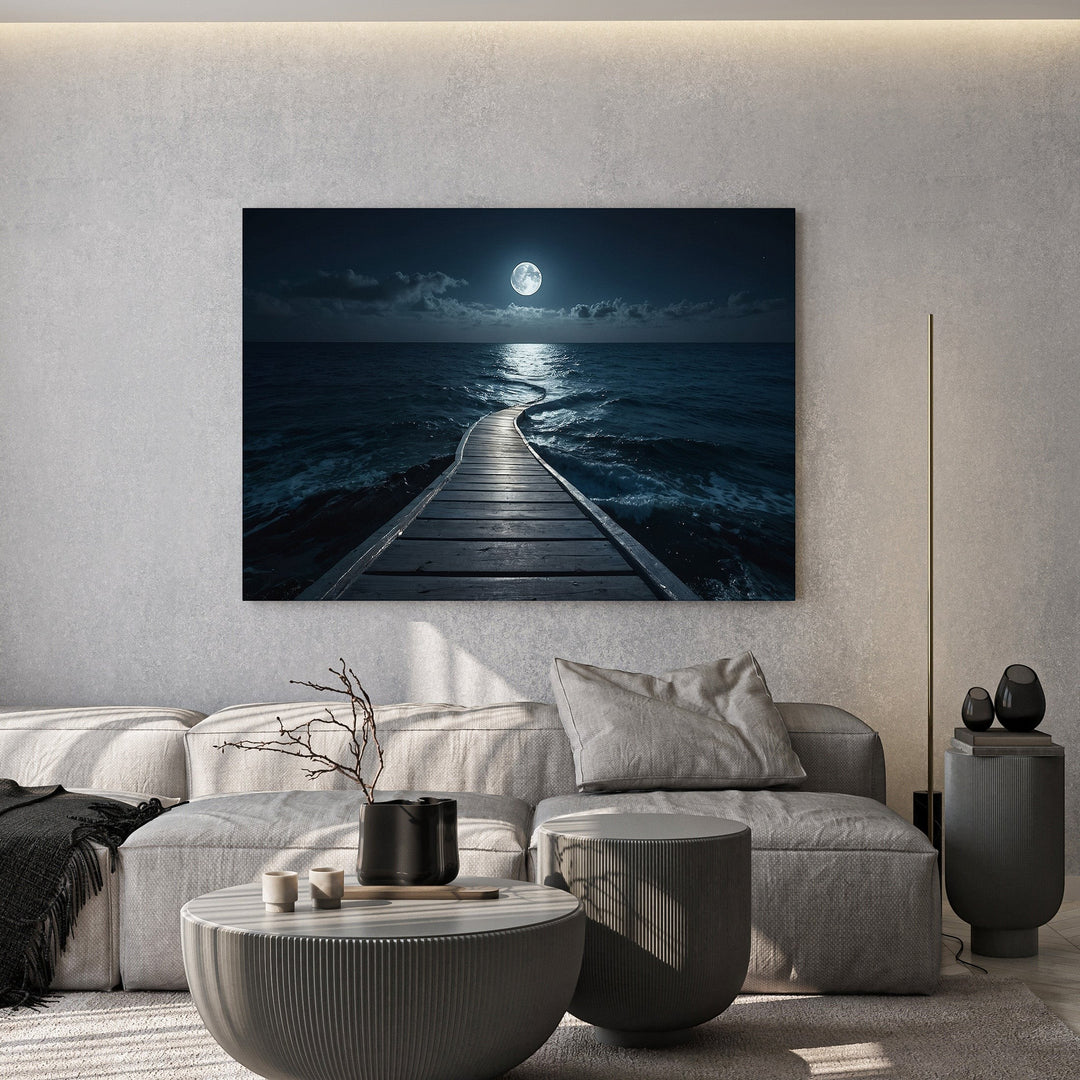 Wadi Home moonlit ocean pier framed wall art print hanging above a modern grey sofa in a minimalist living room.