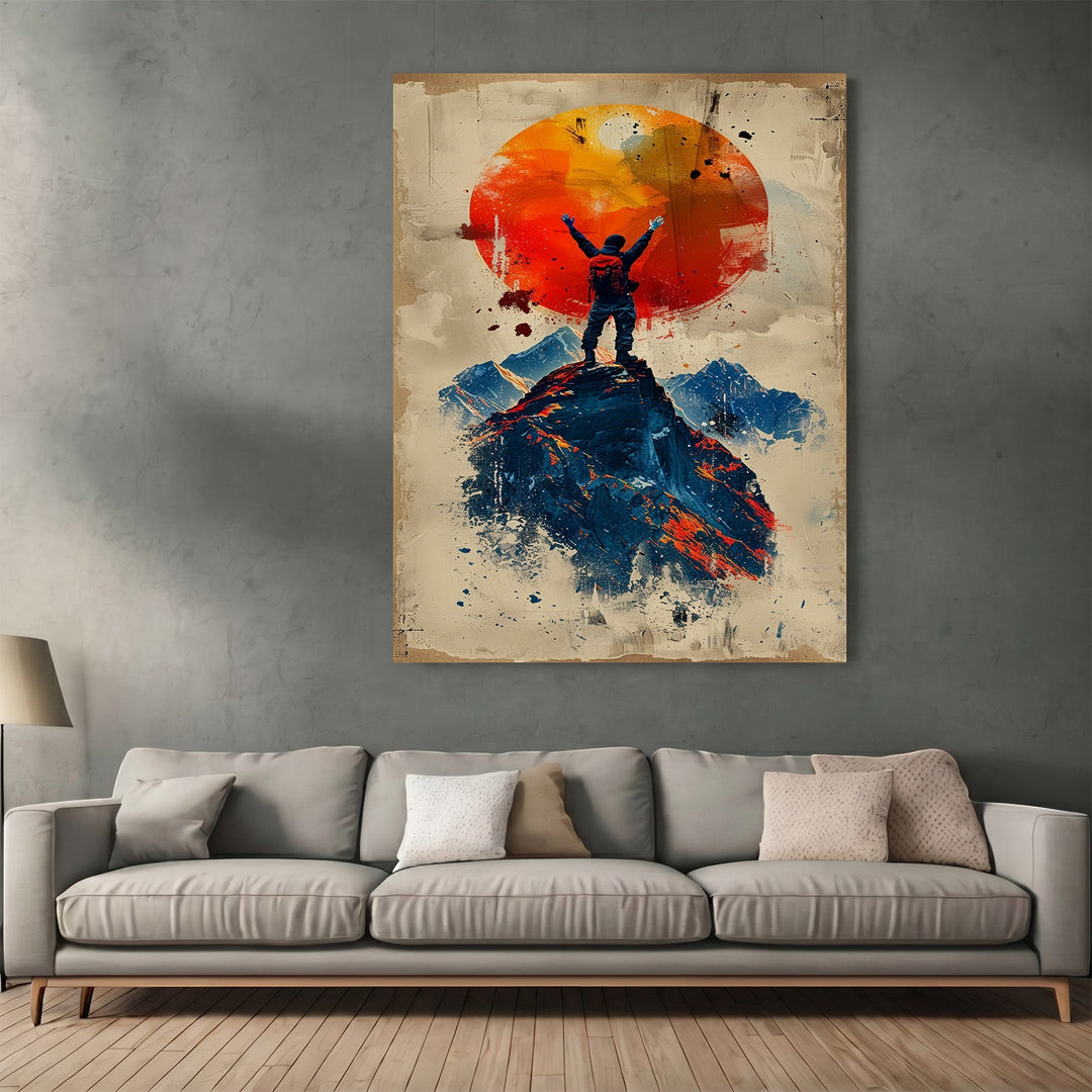 Wadi Home mountain climber wall art print featuring a silhouetted hiker on a peak against a vibrant orange sun.