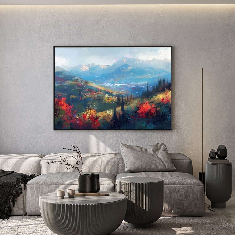 Wadi Home impressionist mountain landscape wall art print with vibrant blue and red tones hanging above a grey sofa.