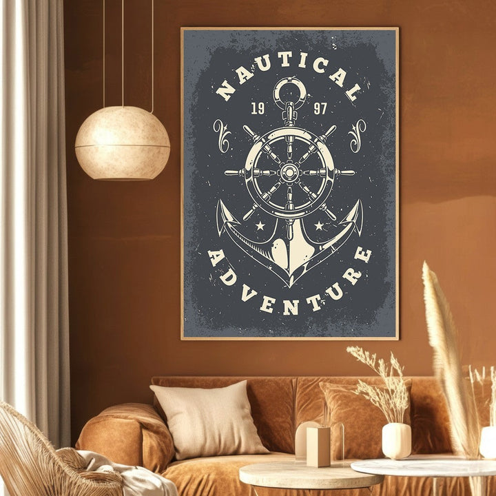 Wadi Home nautical adventure framed wall art featuring a vintage ship wheel and anchor graphic on a dark grey background.