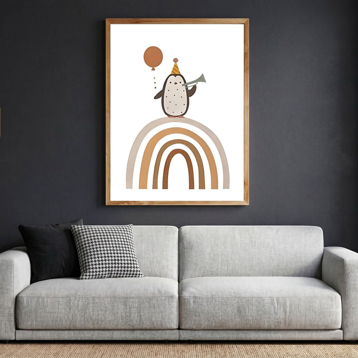 Wadi Home framed wall art featuring a whimsical penguin with a party hat and balloon on a rainbow in a modern living room