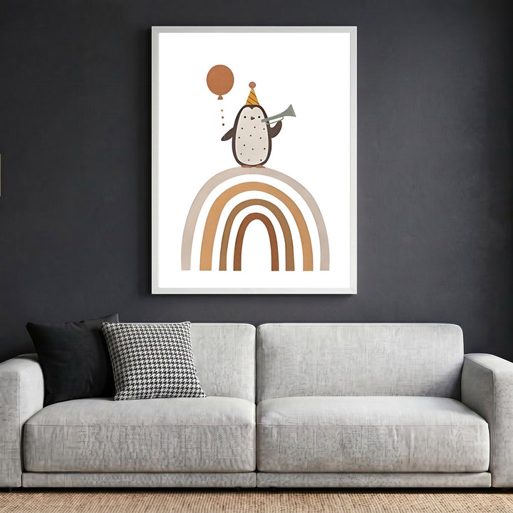 Wadi Home framed wall art featuring a whimsical penguin with a party hat and balloon on a rainbow in a modern living room