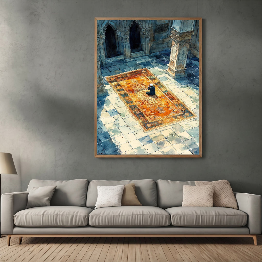 Wadi Home framed wall art print featuring a person praying on an ornate rug in a sunlit stone courtyard.