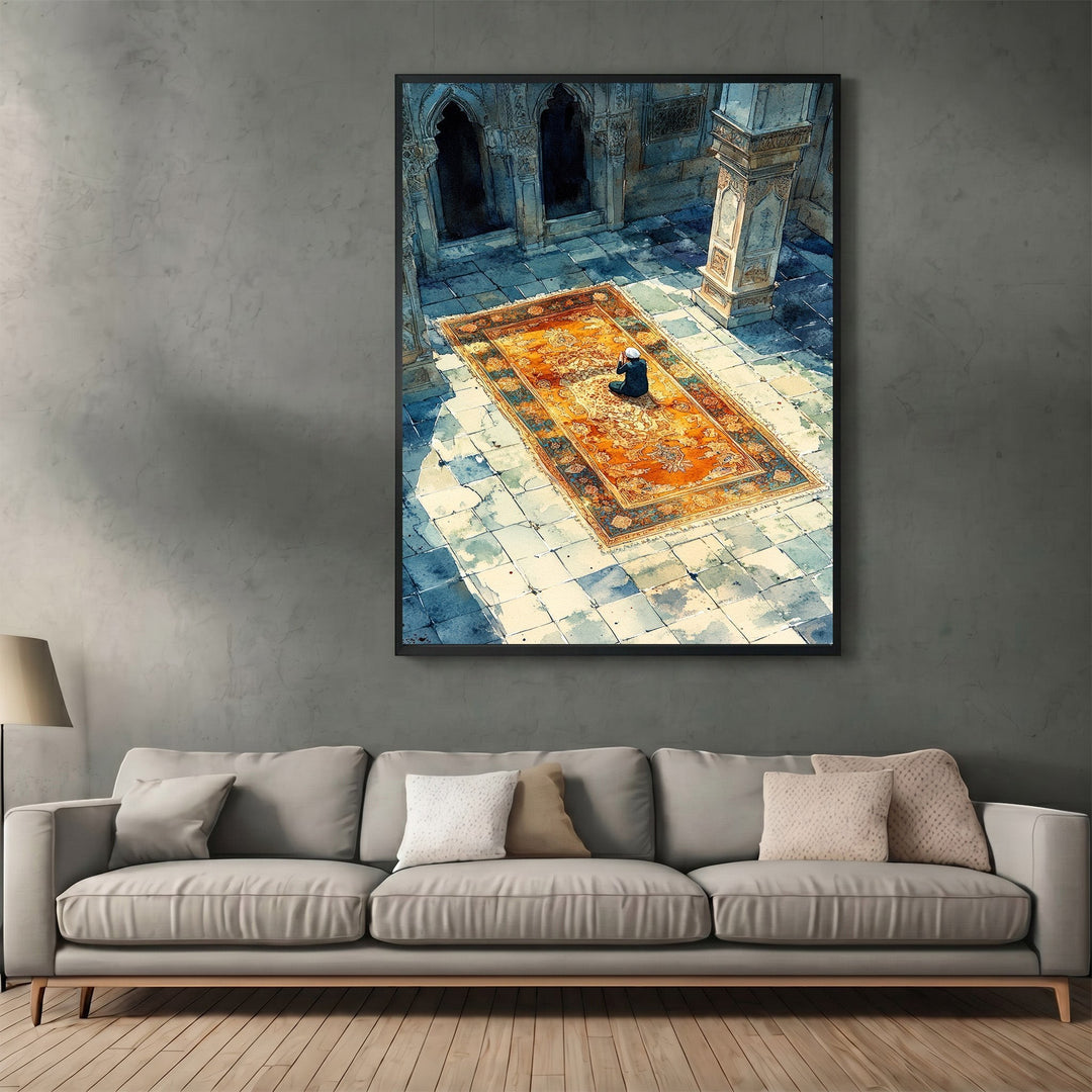 Wadi Home framed wall art print featuring a person praying on an ornate rug in a sunlit stone courtyard.