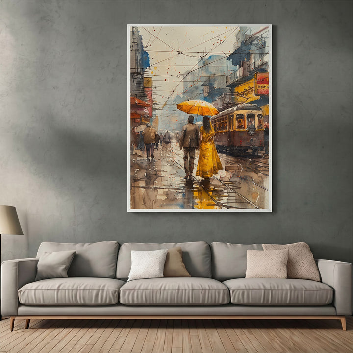 Wadi Home framed watercolor wall art of a couple with a yellow umbrella walking on a rainy city street.