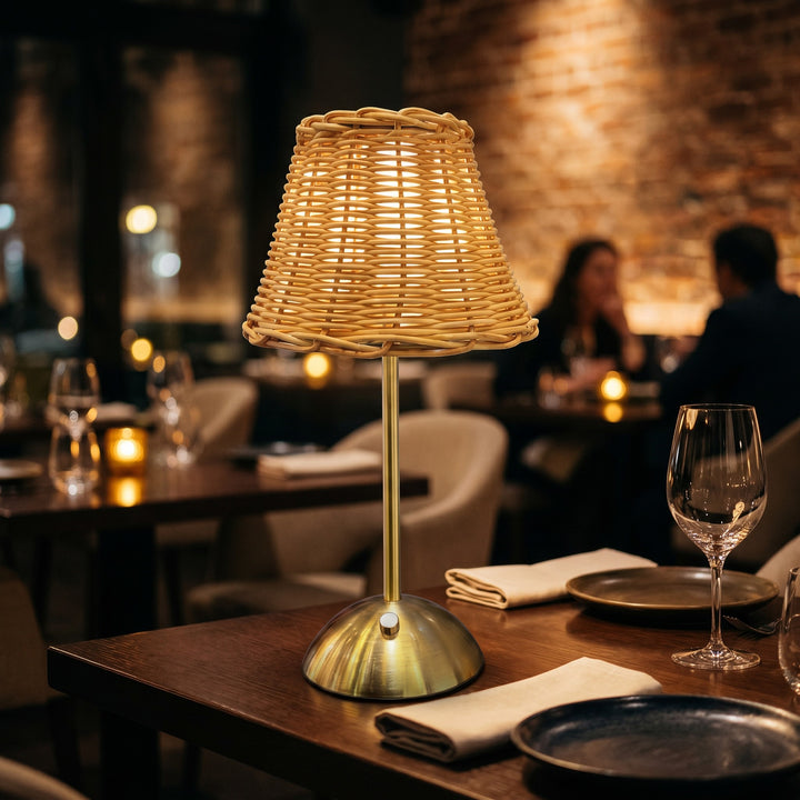 Wadi Home woven rattan table lamp with brushed brass metal base, natural light.