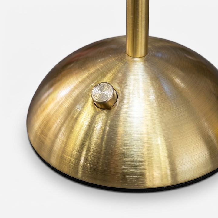 Wadi Home Woven Rattan Table Lamp with brushed brass metal base and switch. Natural, organic texture.