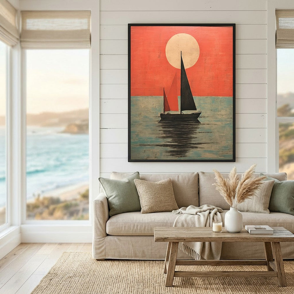 Wadi Home framed sailboat wall art print featuring a red sunset and teal ocean, displayed above a neutral living room sofa.