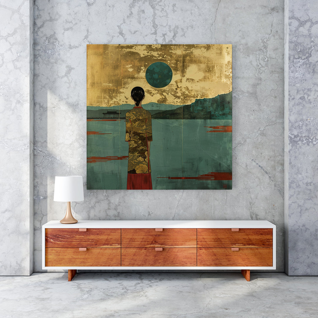 Wadi Home serene landscape wall art with figure in gold patterned robe, teal water, and gold textured sky.