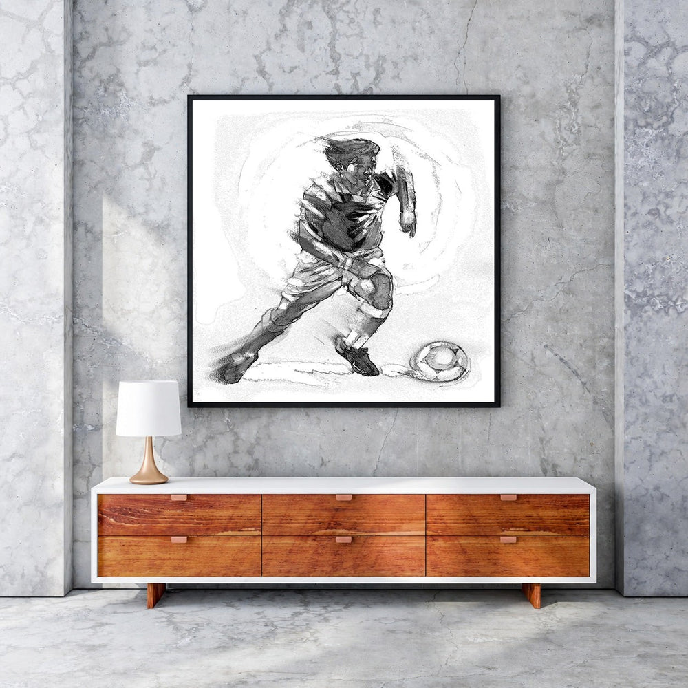 Wadi Home black and white sketch artwork of a soccer player in motion with a ball. Detailed linework captures athletic energy.