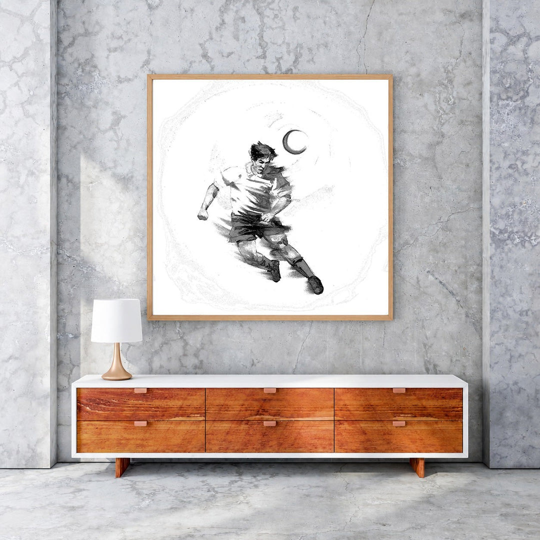 Wadi Home black and white sketch artwork of a soccer player dribbling a ball under a crescent moon.