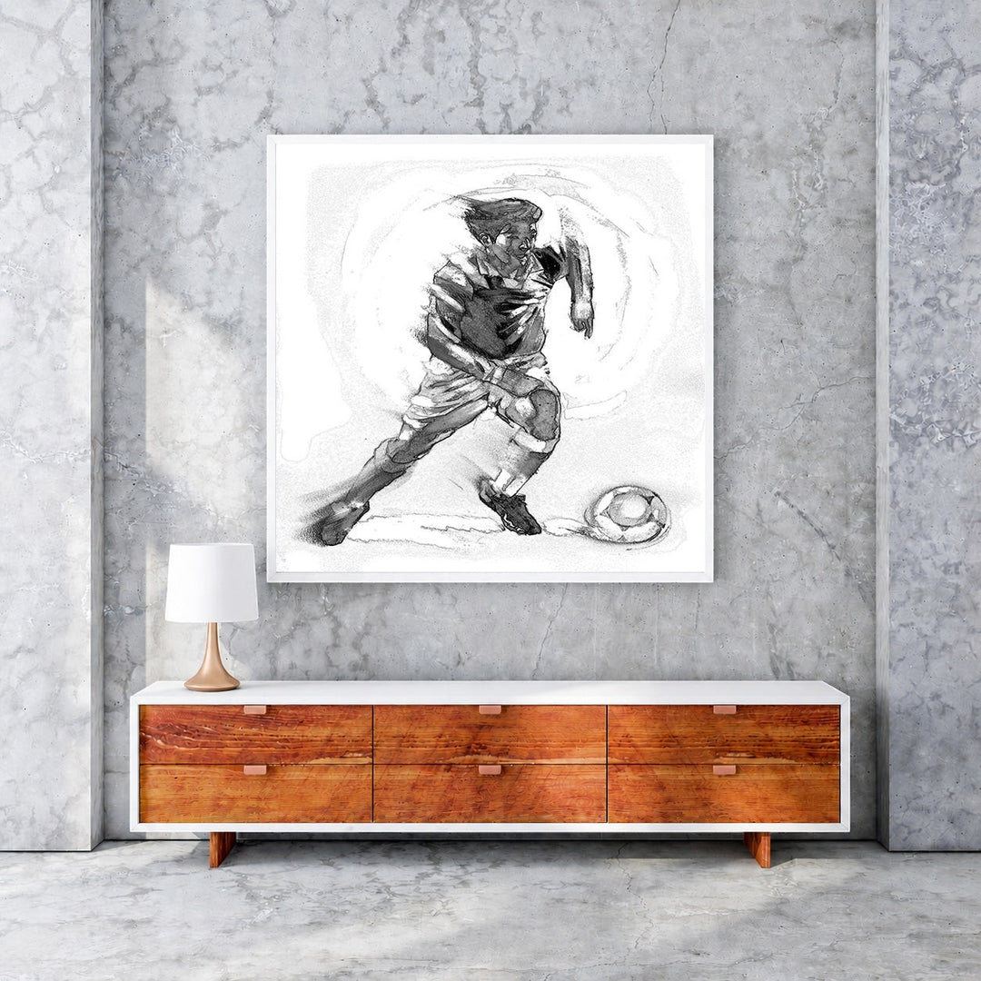 Wadi Home dynamic black and white sketch artwork of a soccer player in motion with a ball.