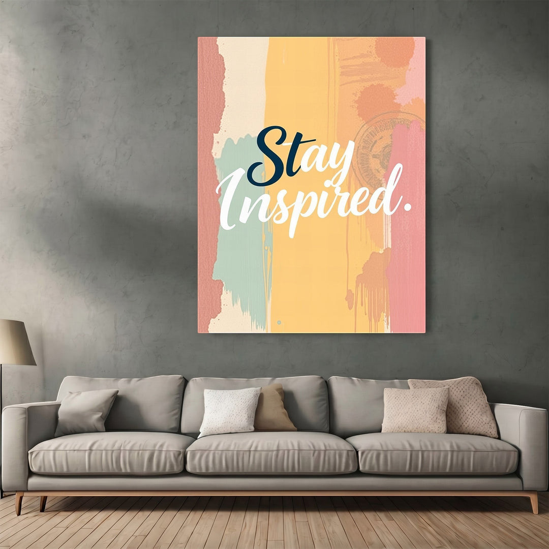 Wadi Home Stay Inspired wall art print with abstract yellow, pink, and teal brushstrokes above a modern grey sofa.
