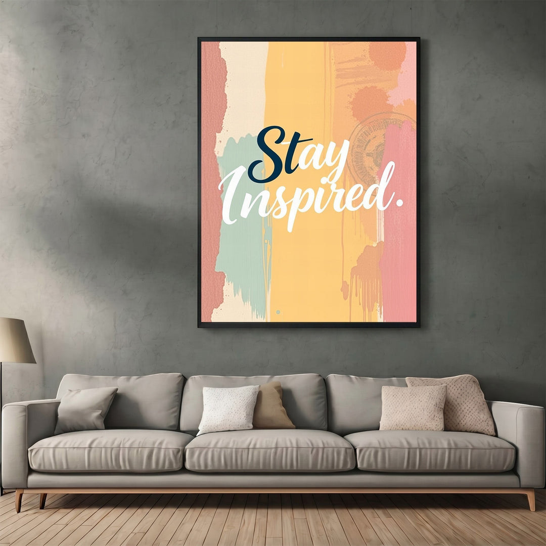 Wadi Home Stay Inspired wall art print with abstract yellow, pink, and teal background hanging above a grey sofa.