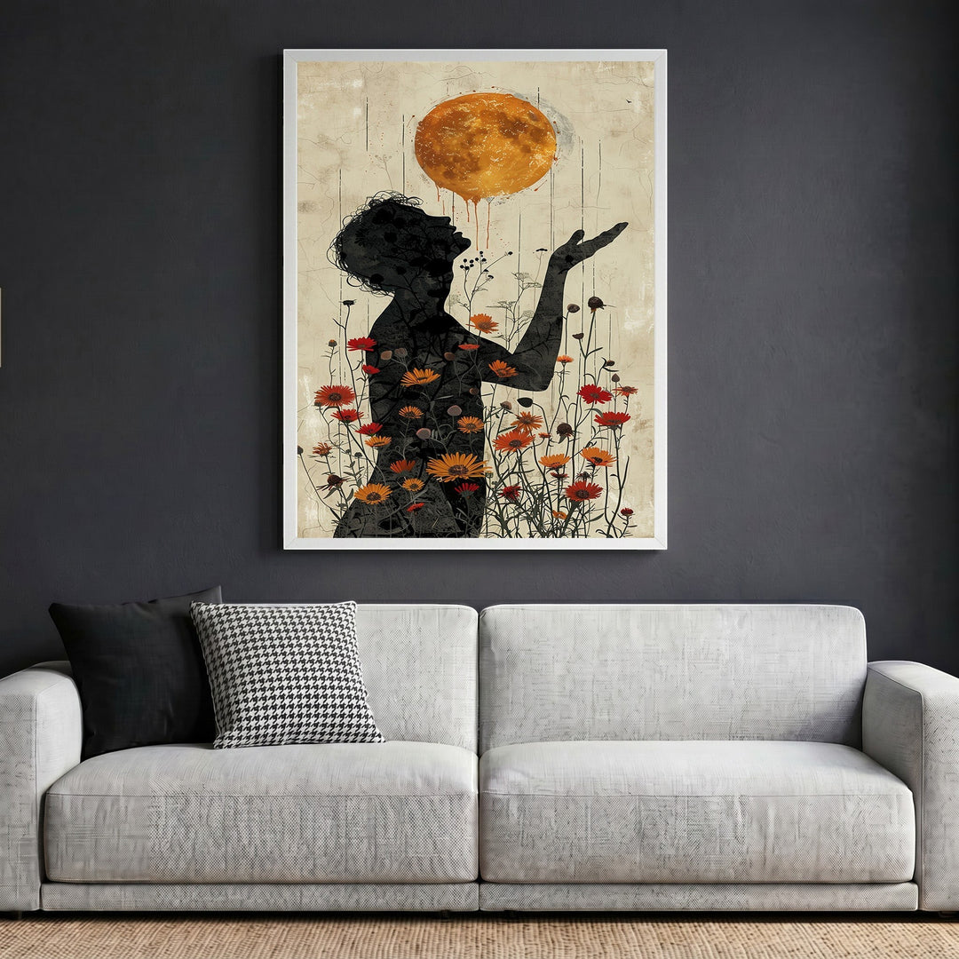 Wadi Home surreal floral silhouette wall art print featuring a golden sun and wildflowers above a modern grey sofa.