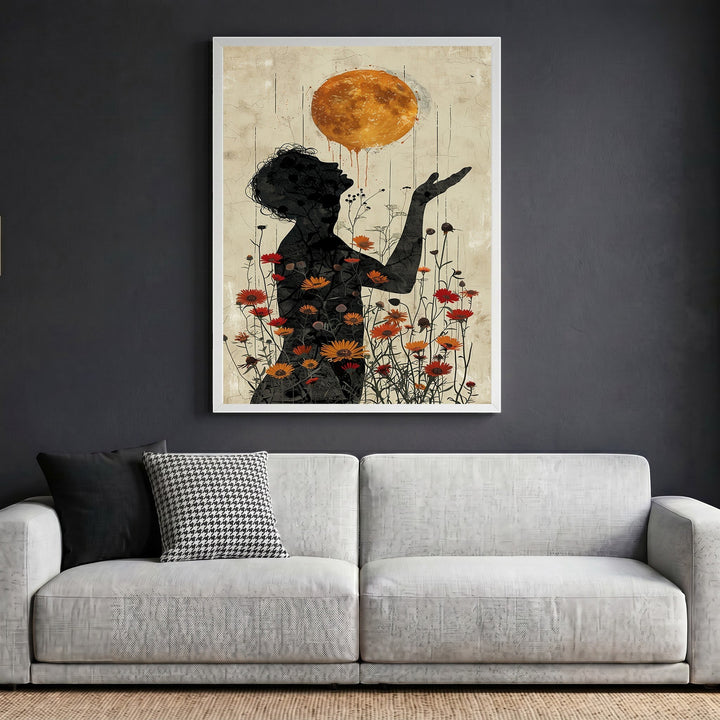 Wadi Home surreal floral silhouette wall art print featuring a golden sun and wildflowers above a modern grey sofa.