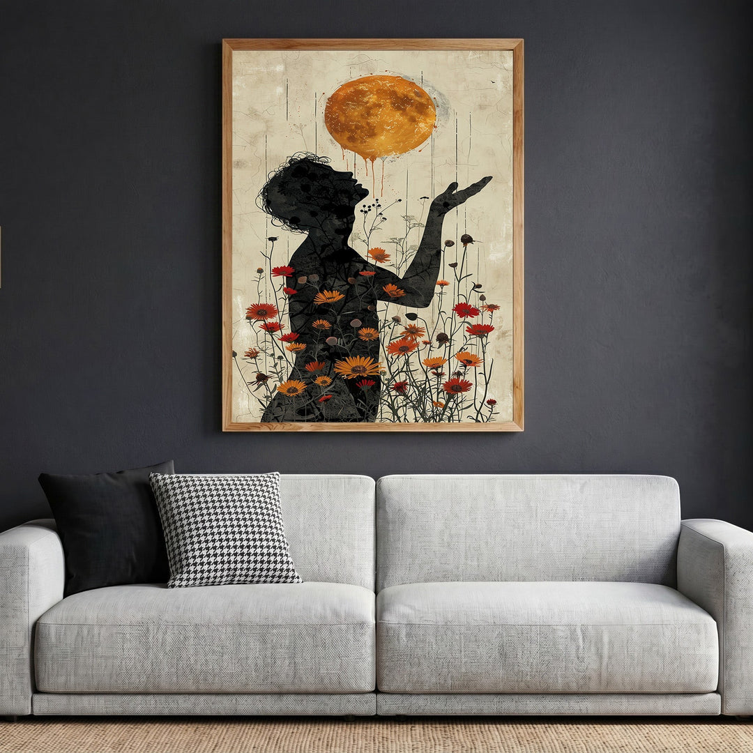 Wadi Home surreal silhouette floral wall art print featuring a golden sun and wildflowers in a wooden frame on a wall.