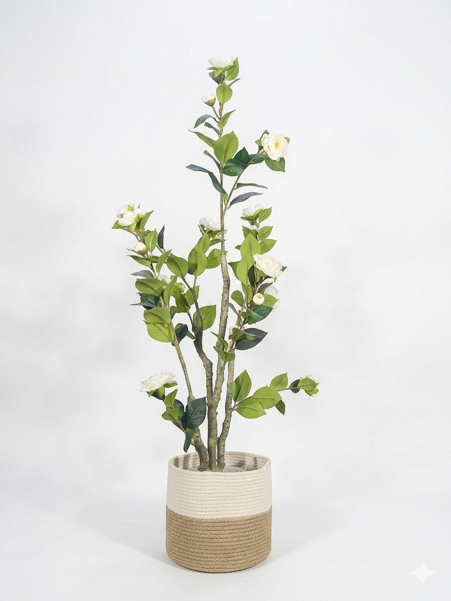 Wadi Home Tall Faux Camellia Tree with white blooms and green leaves in a two-toned woven planter.