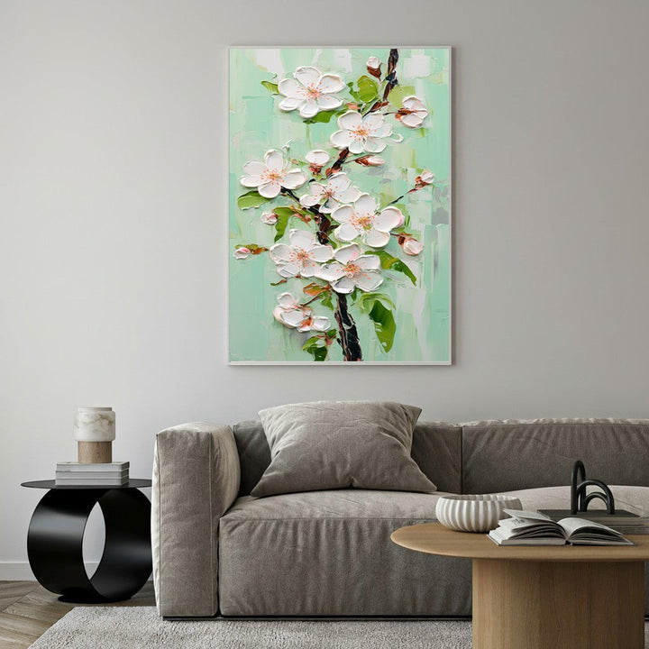 Wadi Home textured wall art with white cherry blossoms and green leaves on a pastel mint background. Impasto technique.
