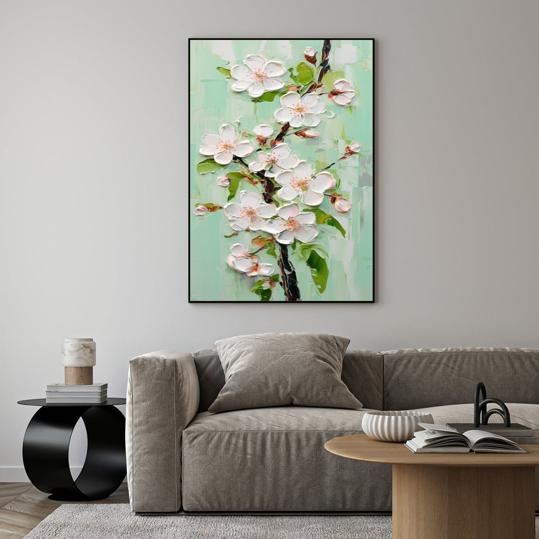 Wadi Home Textured Cherry Blossom Branch Wall Art with thick impasto white blossoms and green leaves on a pastel green background.