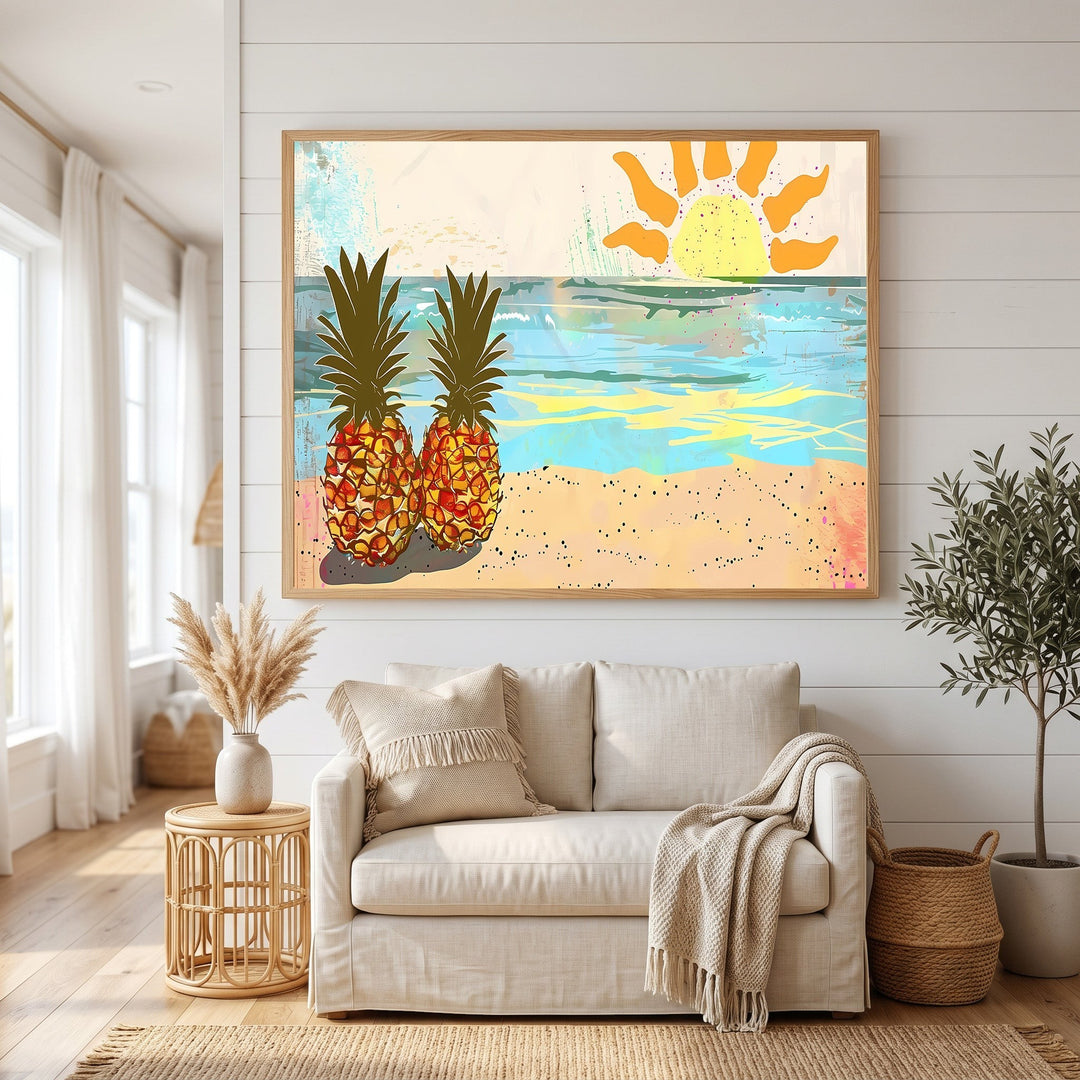 Wadi Home tropical pineapple beach wall art print in a wooden frame hanging above a beige sofa in a bright room.