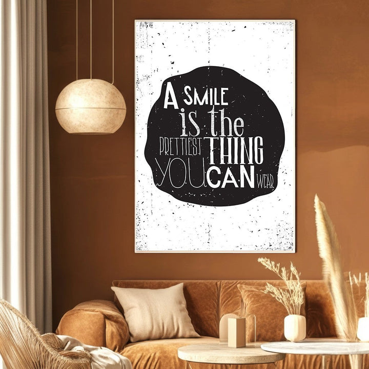 Wadi Home typography wall art print with a smile quote in white text on a distressed black shape in a modern room.