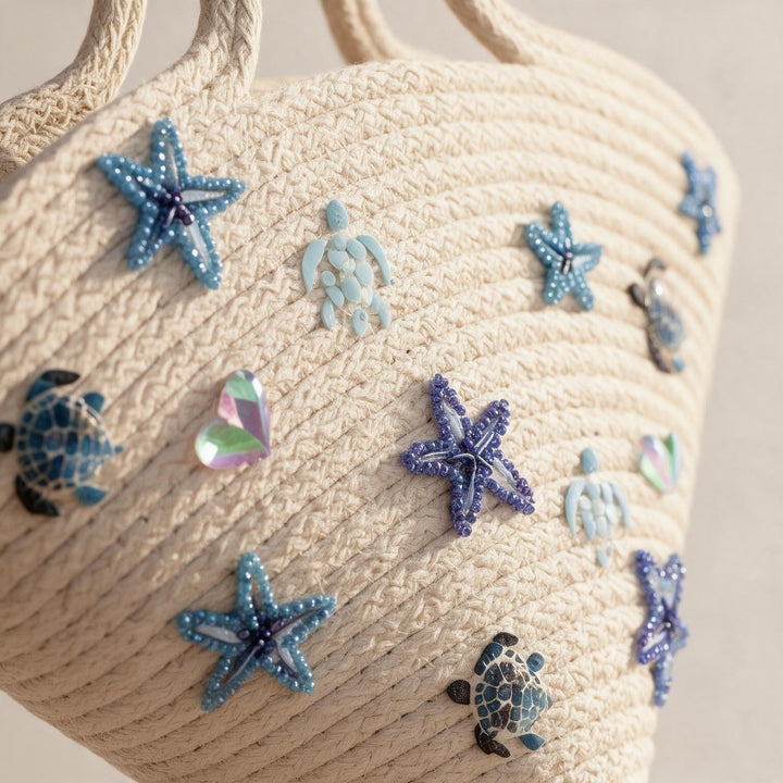 Wadi Home off-white woven beach tote bag with blue beaded starfish and sea turtle embellishments