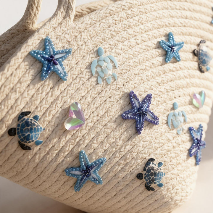 Wadi Home off-white woven rope beach tote bag decorated with blue beaded starfish and sea turtle embellishments