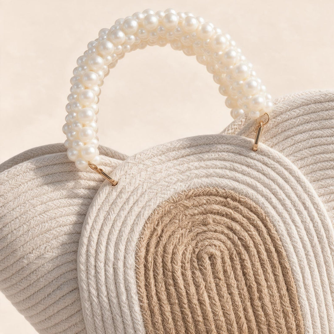 Wadi Home beige braided rope handbag featuring a decorative pearl-beaded handle for a chic summer style.