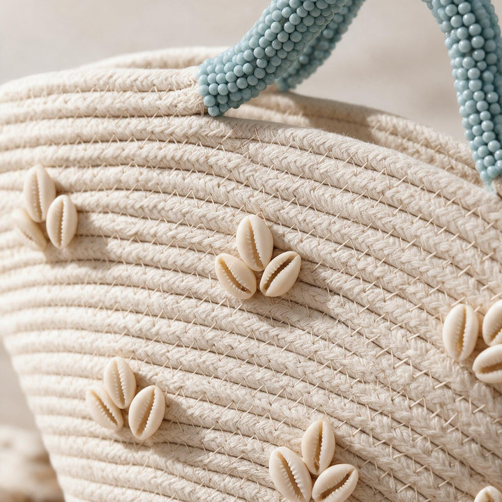 Wadi Home beige woven beach handbag with shell embellishments and light blue beaded handles