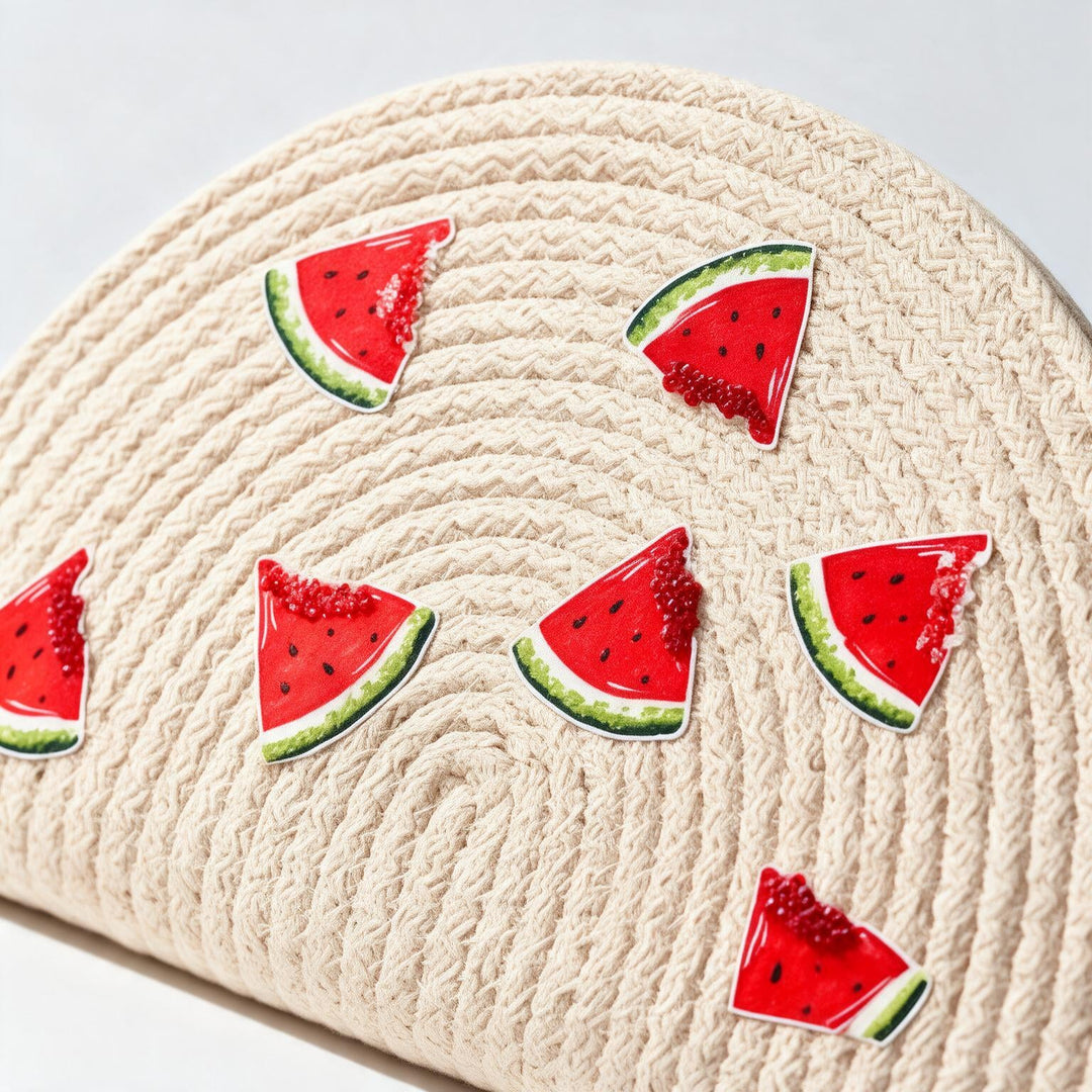 Wadi Home beige woven half moon clutch with playful watermelon slice prints for a summer beach look