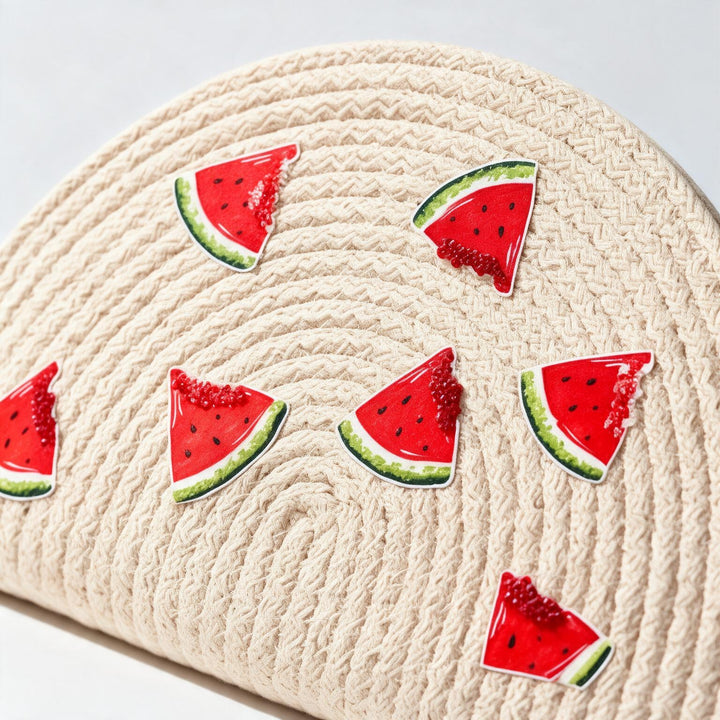 Wadi Home beige woven half moon clutch with playful watermelon slice prints for a summer beach look