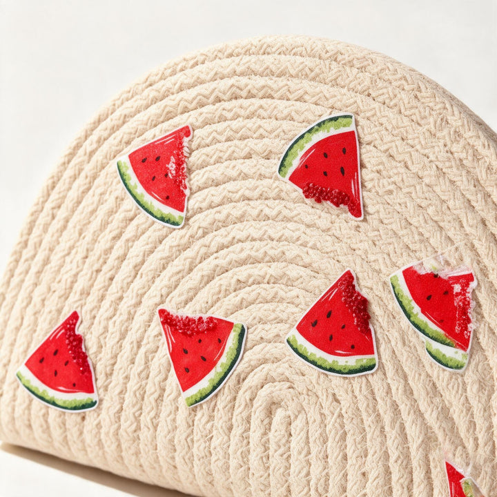 Wadi Home beige woven half moon clutch with playful watermelon slice prints for a summer beach look