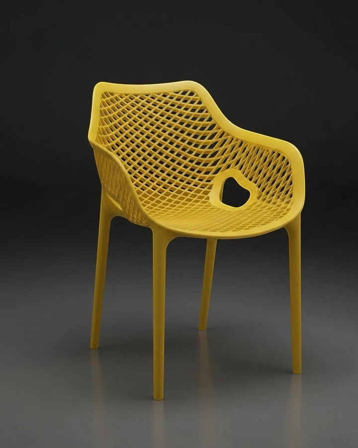 Wadi Home yellow modern armchair with an intricate lattice pattern, ergonomic armrests, and a sleek minimalist design.