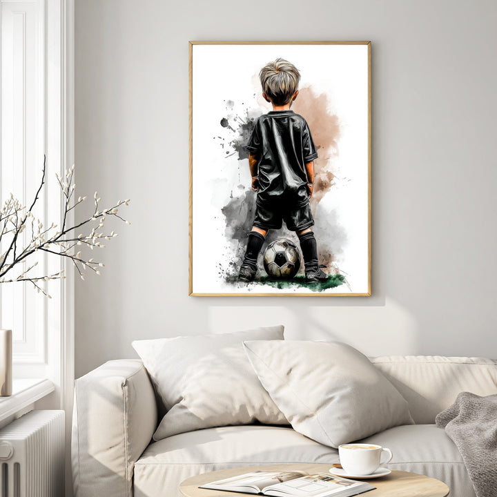 Wadi Home artwork of a young boy in a black soccer uniform with a ball at his feet, watercolor style.