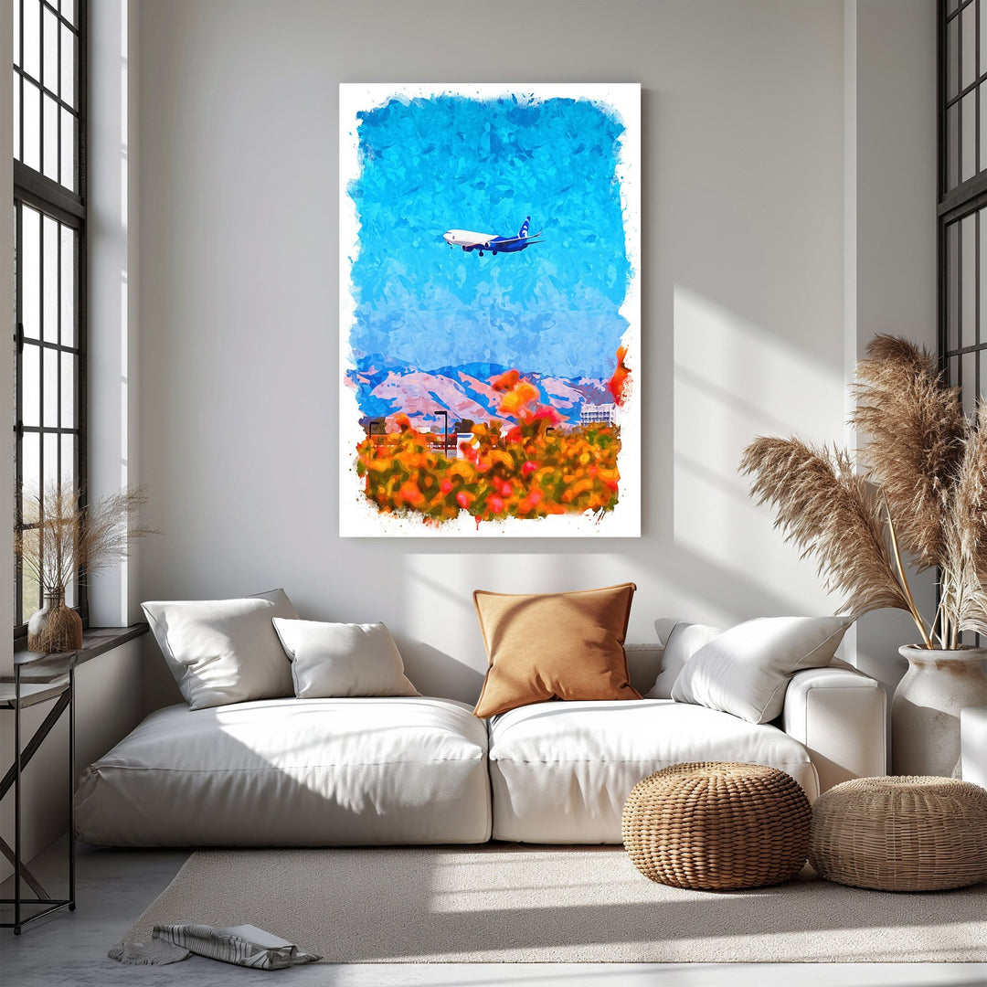 Wadi Home abstract airplane over colorful landscape watercolor-style canvas print. Vibrant blues, oranges, and reds.