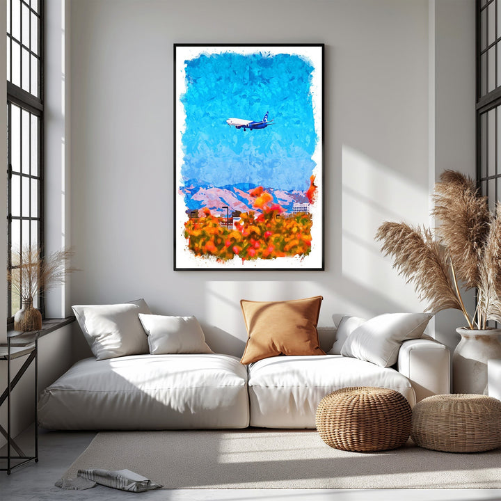 Wadi Home abstract airplane over colorful landscape watercolor-style wall art. Blue sky, mountains, and vibrant orange and red foliage.