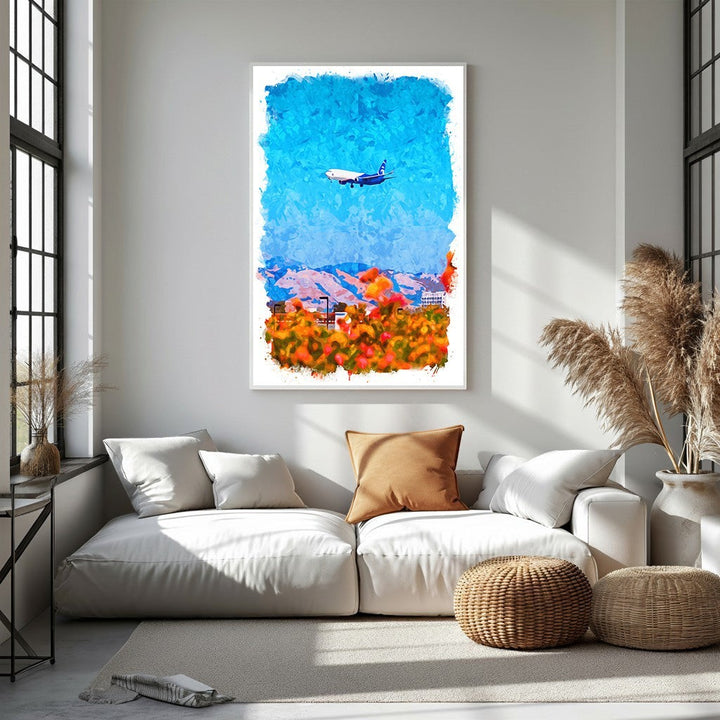 Wadi Home abstract airplane wall art with watercolor style, featuring a plane over colorful landscape with blue sky and orange land.