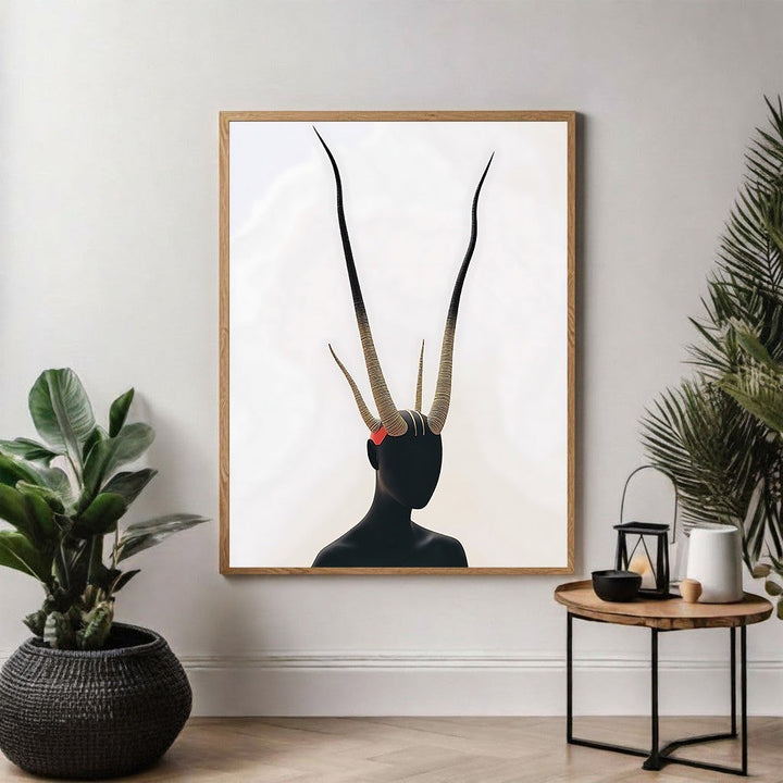 Wadi Home abstract portrait wall art featuring a black silhouette with dramatic, elongated antlers and a red accent.