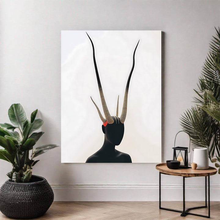 Wadi Home abstract wall art featuring a black silhouette with large, textured, golden antlers and a red accent.